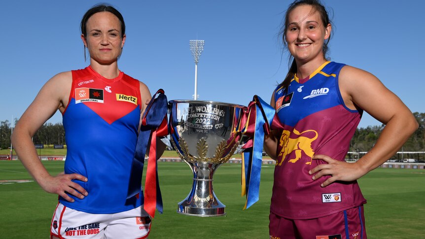 Daisy Pearce and Breanna Koenen hold the AFLW premiership cup between them