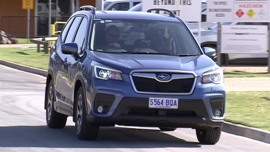 A greyish blue Subaru four-wheel drive