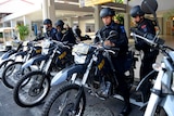 Indonesian Special Police on motorbikes prepare to patrol at Ngurah Rai Airport in Denpasar on Indonesia's resort island of Bali