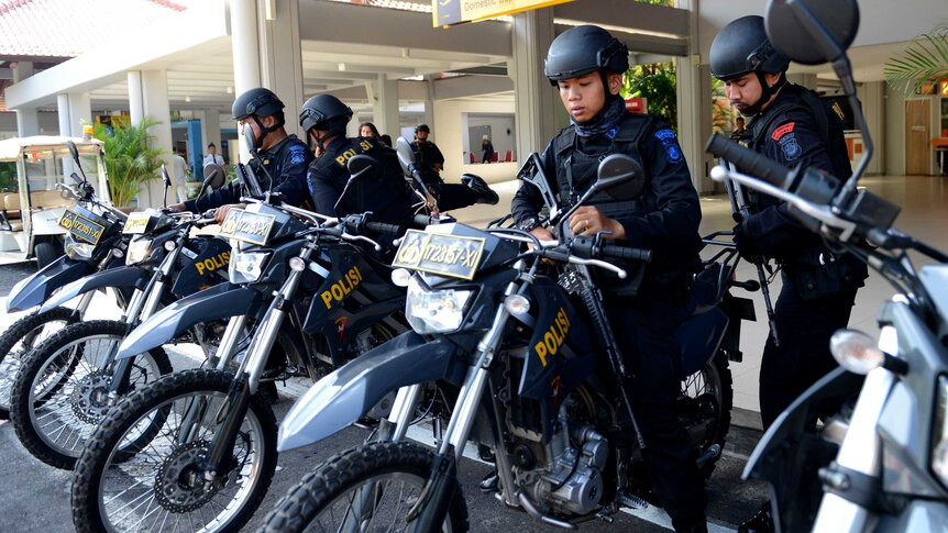 Indonesian Special Police on motorbikes prepare to patrol at Ngurah Rai Airport in Denpasar on Indonesia's resort island of Bali