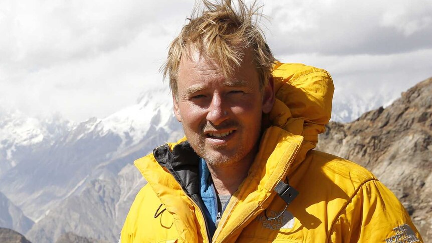 Hugh Brown standing atop a mountain in Pakistan