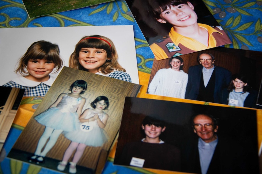 Photos of the Foster sisters as kids are spread out on a table.