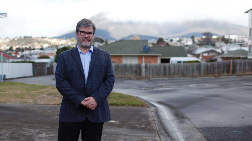 Professor James Vickers stands at the site of proposed dementia village