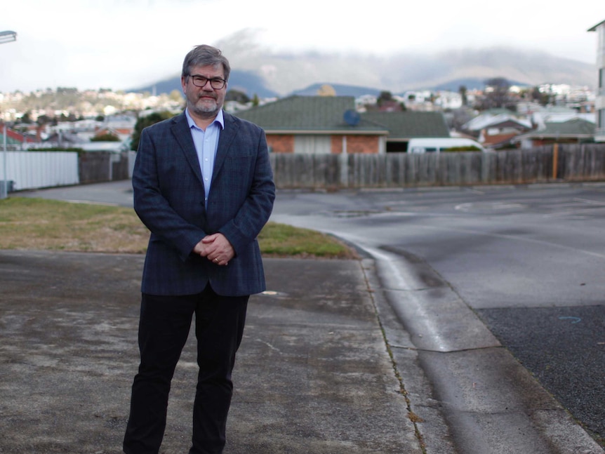 Professor James Vickers stands at the site of proposed dementia village