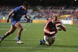 Try time ... Tom Croft dives over for a Lions five-pointer
