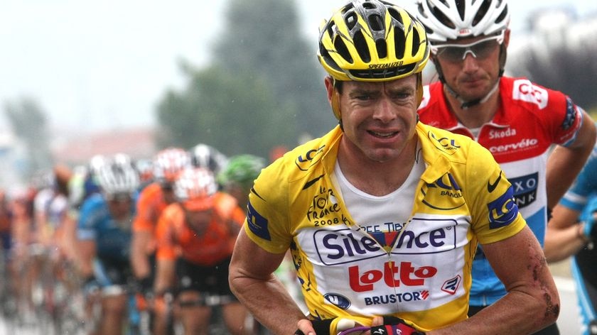 Cadel Evans rides with the peloton