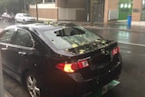 A car with a smashed back window