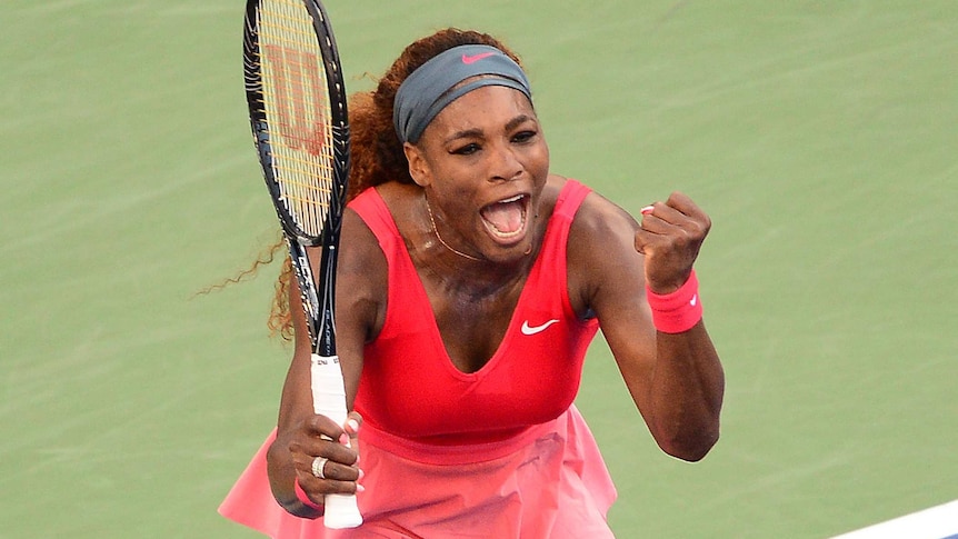 Serena Williams reacts to beating Li Na in the US Open semi-final