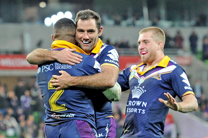 Cameron Smith congratulates Marika Koroibete (L) for his try for the Storm against Penrith.