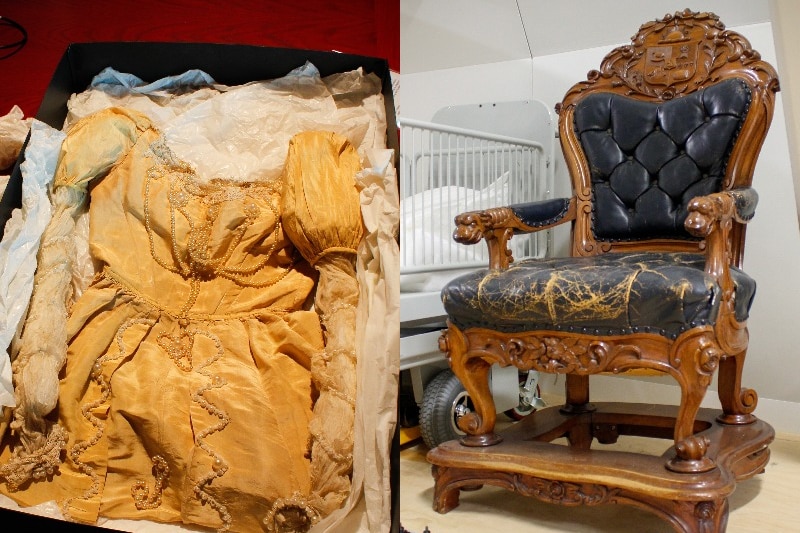 Composite image of an ancient ballgown and ornate chair