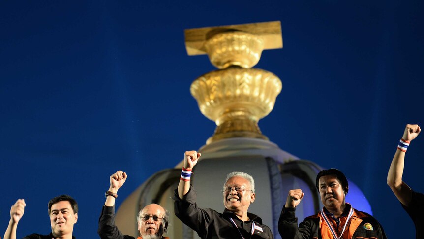 Thai opposition leaders appear on stage during a rally