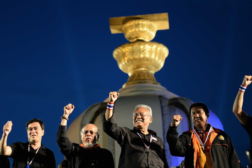 Thai opposition leaders appear on stage during a rally