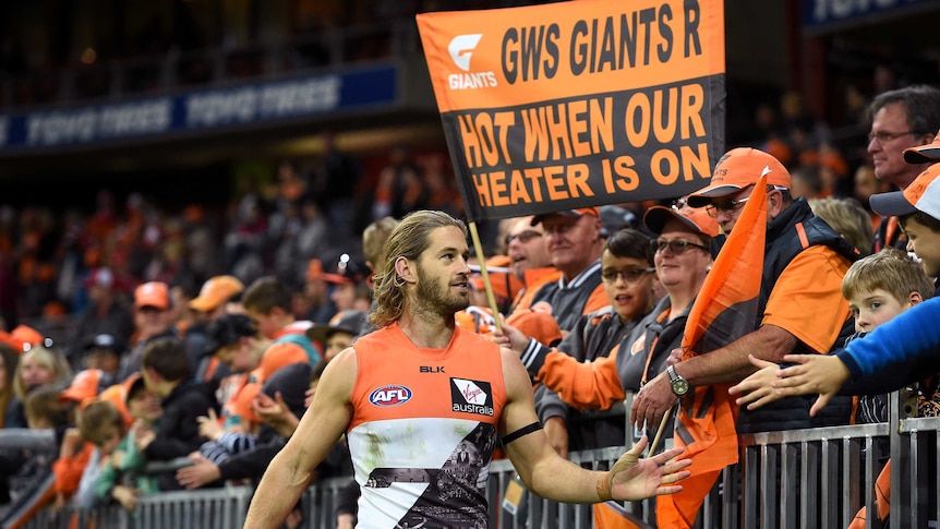 The Giants' Callan Ward thanks fans after GWS beats Sydney at Sydney Showgrounds on June 12, 2016.