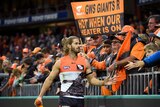 The Giants' Callan Ward thanks fans after GWS beats Sydney at Sydney Showgrounds on June 12, 2016.