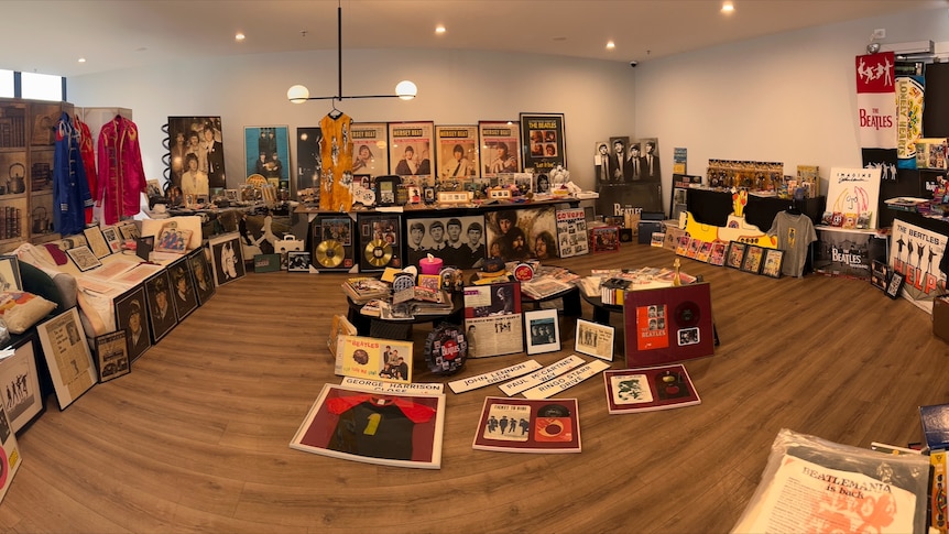 A massive collection of Beatles memorabilia displayed in an open plan room.