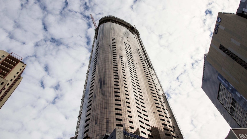 A tall apartment building under construction