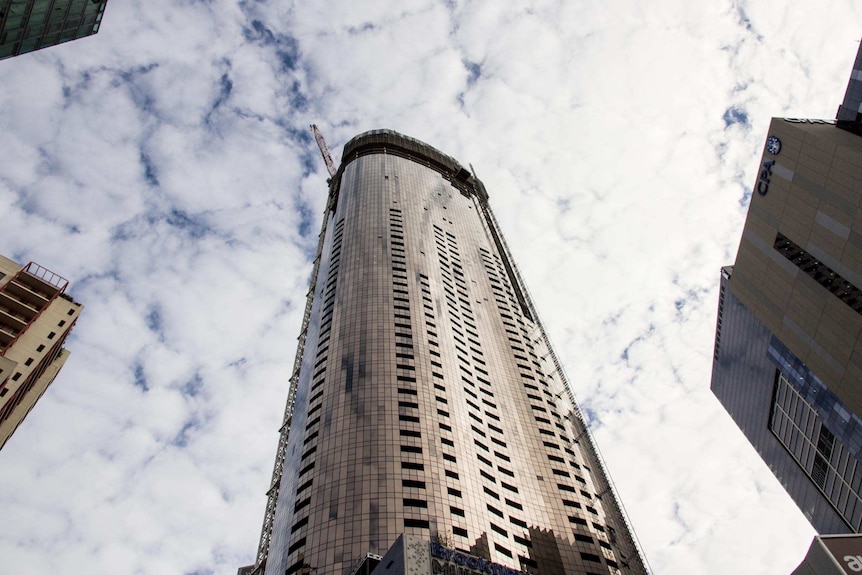 A tall apartment building under construction.