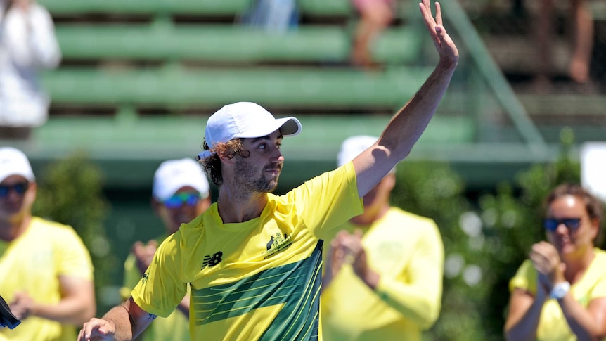 Australia's Jordan Thompson waves to fans after his Davis Cup win over Czech Jiri Vesely at Kooyong.