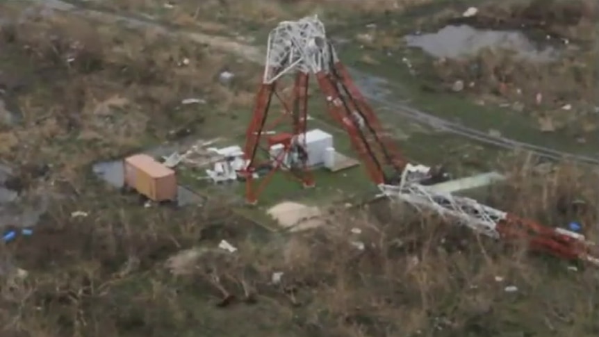 Aerial vision shows a large radio antenna snapped in half by hurricane irma