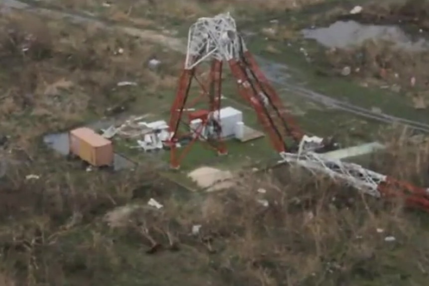 Aerial vision shows a large radio antenna snapped in half by hurricane irma