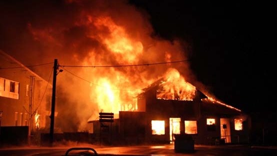 Fire destroys a building housing King Island's only pharmacy.