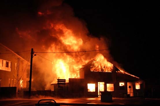 Fire destroys a building housing King Island's only pharmacy.