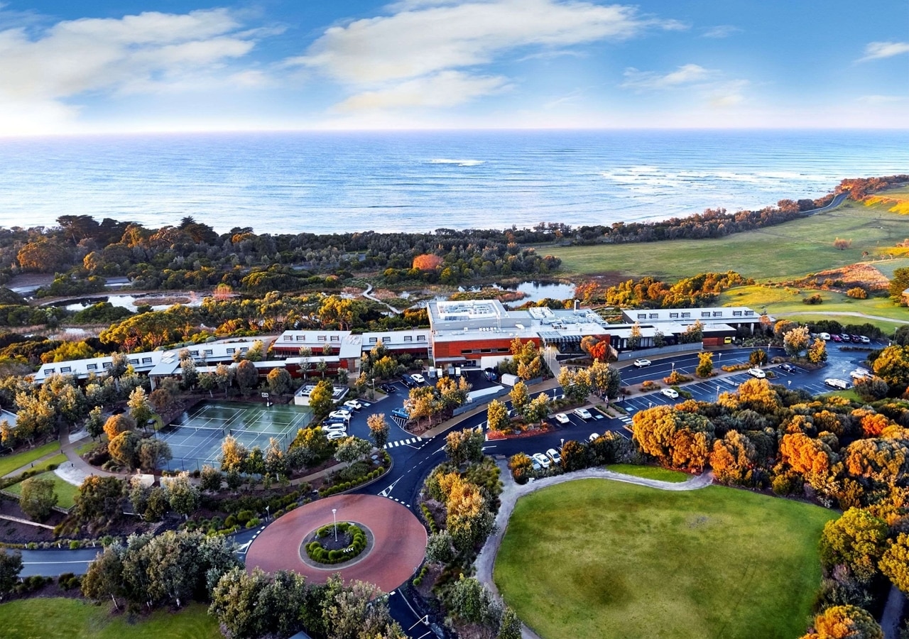 An aerial photo showing the RACV resort near the coastline.