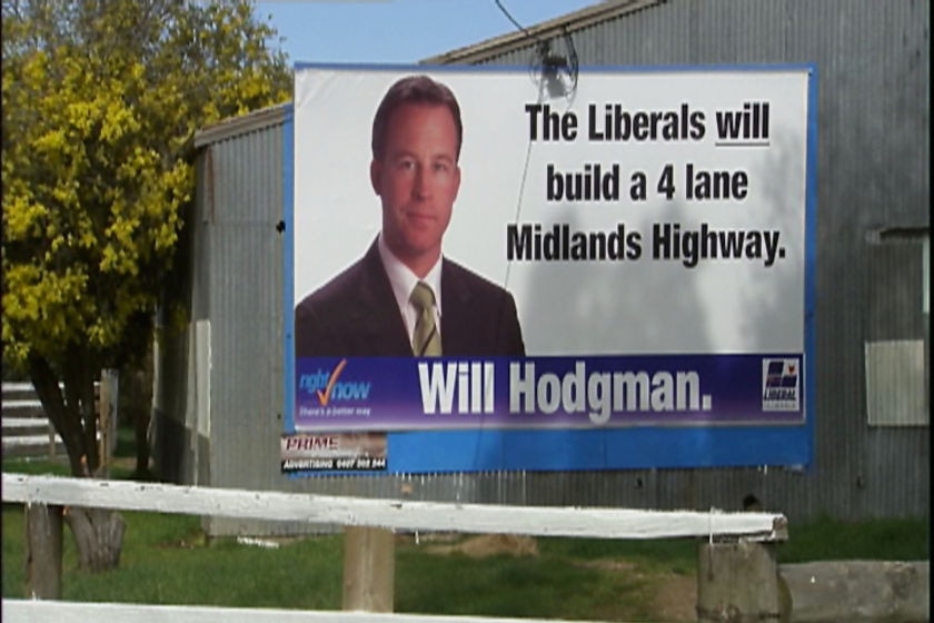 Will Hodgman poster on Midland Highway upgrade TV still