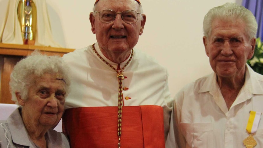 Georgetown's Carl and Judy Nolan with Cardinal Cassidy who presented the medals and citations.