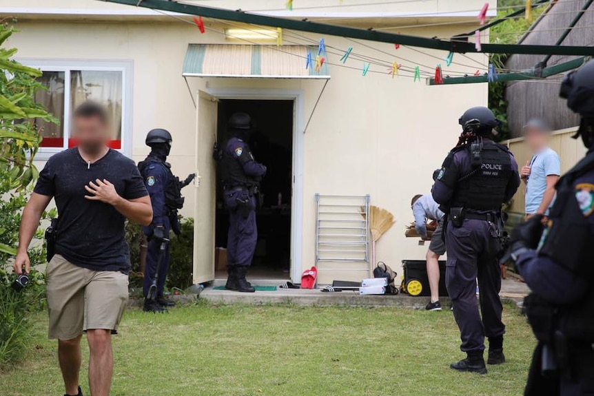 NSW Police outside a home in Sydney during a drug raid