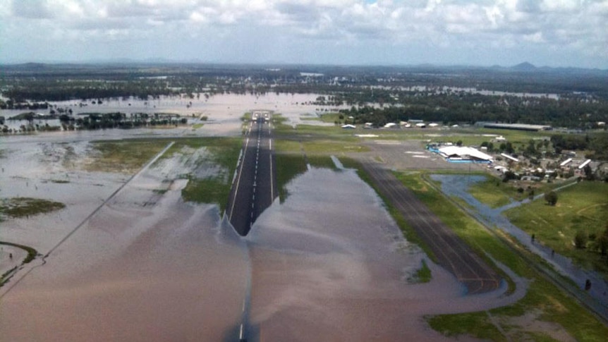 The runway at Rockhampton Airport is flooded.