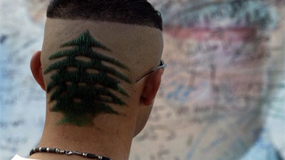 A Lebanese youth with his hair cut into the shape of a cedar tree - the country's national emblem. In this instance the desig...