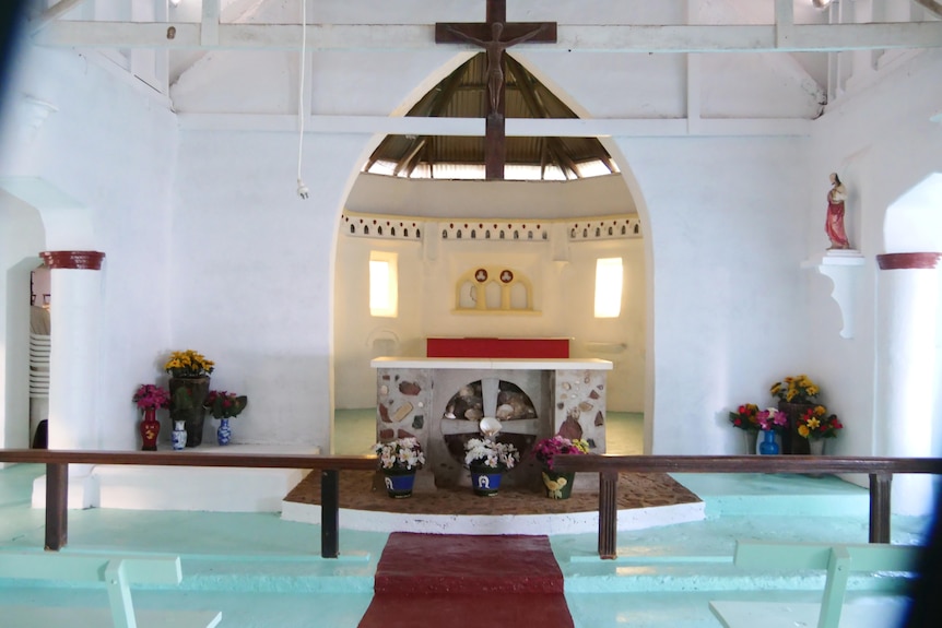 a church alter decorated with Torres Strait pots and shells