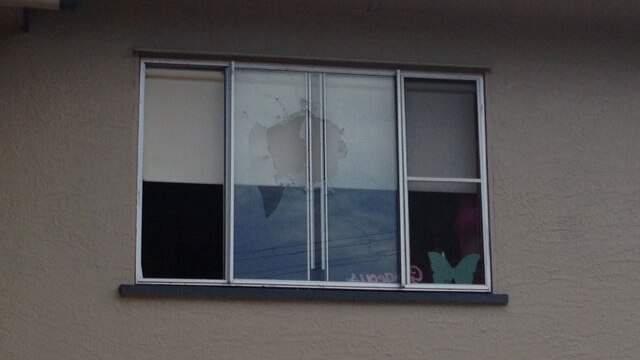 A bullet smashed through the window of this bedroom where a child was sleeping.