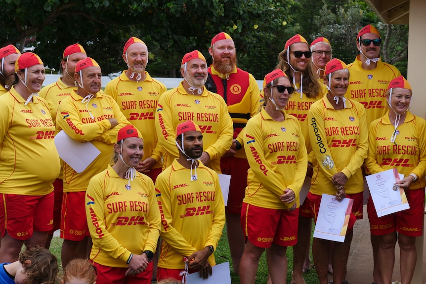 A group of people in surf lifesaving clothes.
