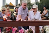 People attending a candlelight vigil in Surfers Paradise
