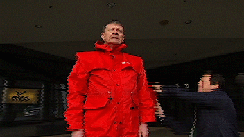 Red Symons drenched by AFL CEO Gillon McLauchlan