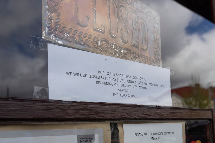 A sign on the door of a Hobart business announcing it is closed for three days.