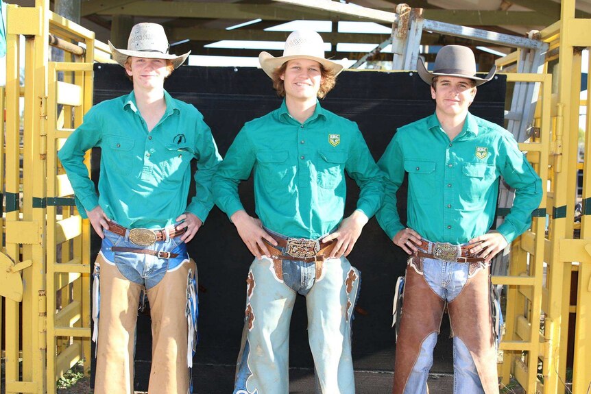 Three St Brendan's Rodeo Club students stand side by side wearing their rodeo gear