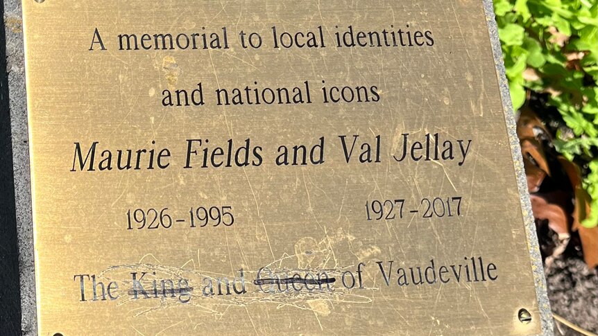 A vandalised memorial plaque