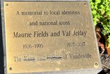 A vandalised memorial plaque