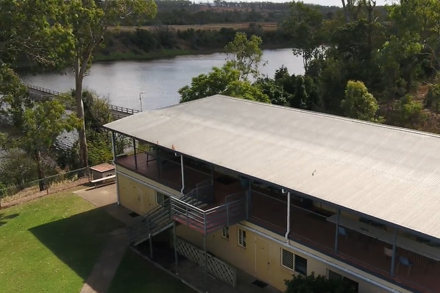 Drone shot of a former tobacco shed turned into a rowers dormitory next to the river