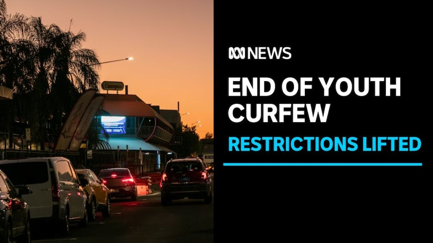 End of Youth Curfew, Restrictions Lifted: A car drives down a street at dusk.