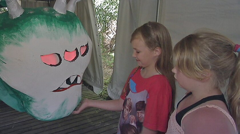 School children take a look at one of the monster sculptures