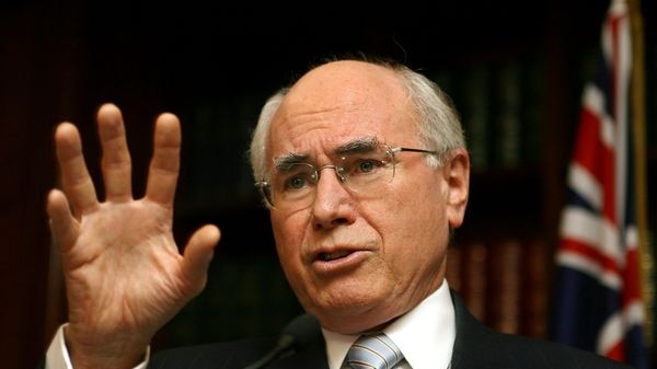 Prime Minister John Howard gestures as he answers questions.