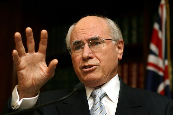 Prime Minister John Howard gestures as he answers questions.