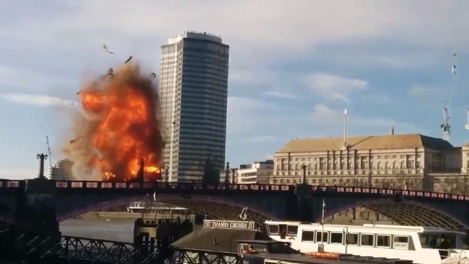 A bus explodes on the Lambeth Bridge in London during filming for The Foreigner.