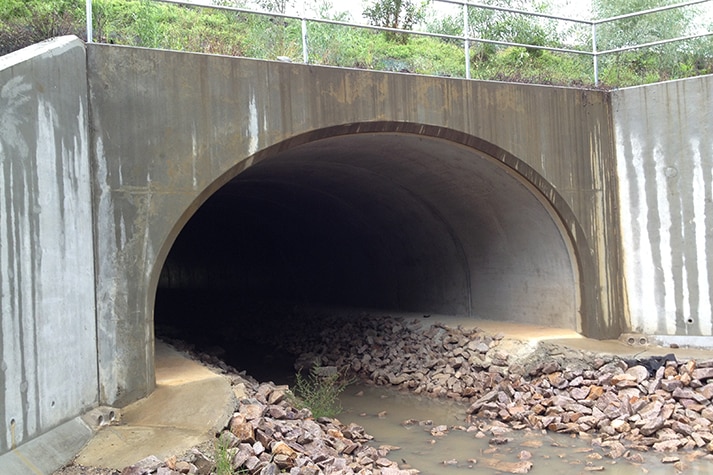 A concrete highway underpass tunnel.