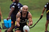 A man passes the ball at Parramatta Eels training