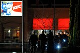 Police search a KFC restaurant after a gun fight.